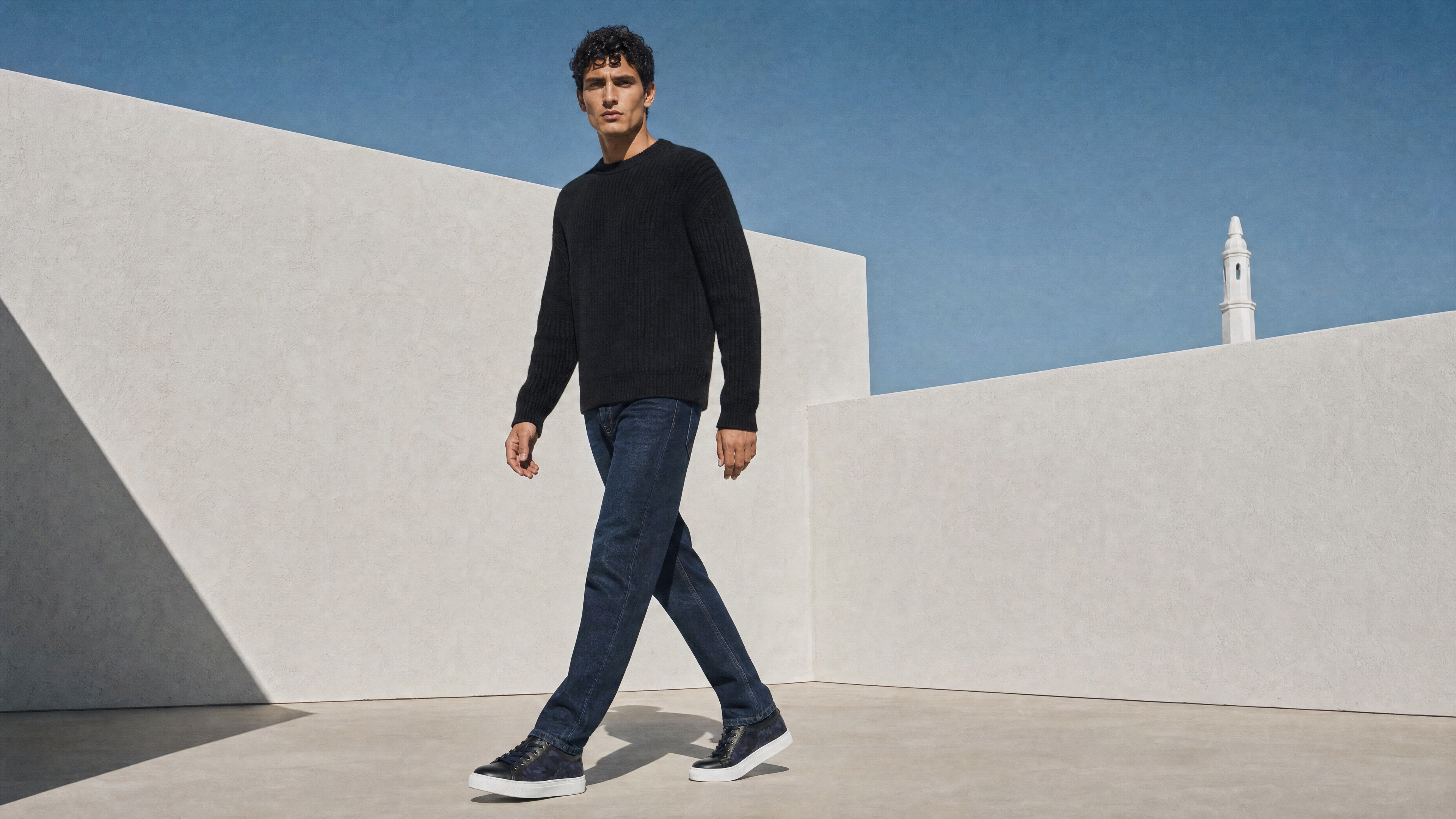 Man wearing Bivando navy camo sneakers walking outdoors in Portugal